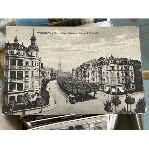 91 - A selection of vintage postcards and Red Cross First Aid books