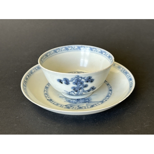 94 - An antique Nanking Cargo blue and white tea bowl and saucer, bears Christies Nanking Cargo label to ... 
