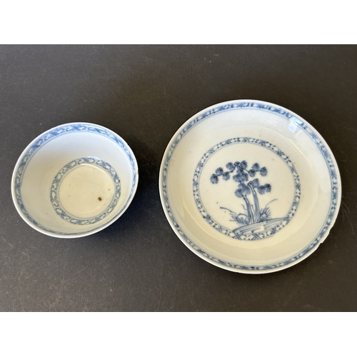 94 - An antique Nanking Cargo blue and white tea bowl and saucer, bears Christies Nanking Cargo label to ... 