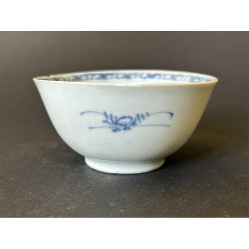 94 - An antique Nanking Cargo blue and white tea bowl and saucer, bears Christies Nanking Cargo label to ... 