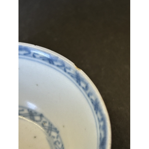 94 - An antique Nanking Cargo blue and white tea bowl and saucer, bears Christies Nanking Cargo label to ... 