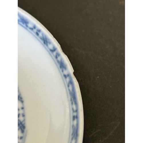 94 - An antique Nanking Cargo blue and white tea bowl and saucer, bears Christies Nanking Cargo label to ... 