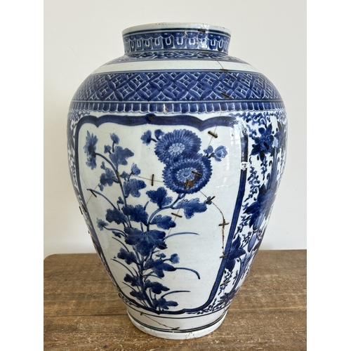 96 - A large Chinese ceramic blue and white hand painted vase, approx. 18 1/2