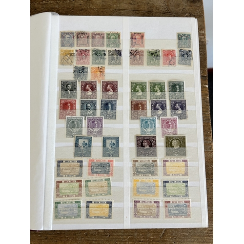 366 - Four stock books of stamps to include two books of Eire stamps, all hinged, one book of German stamp... 