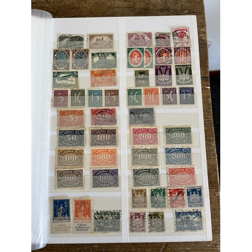 366 - Four stock books of stamps to include two books of Eire stamps, all hinged, one book of German stamp... 
