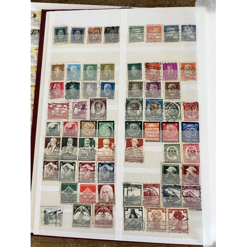 366 - Four stock books of stamps to include two books of Eire stamps, all hinged, one book of German stamp... 