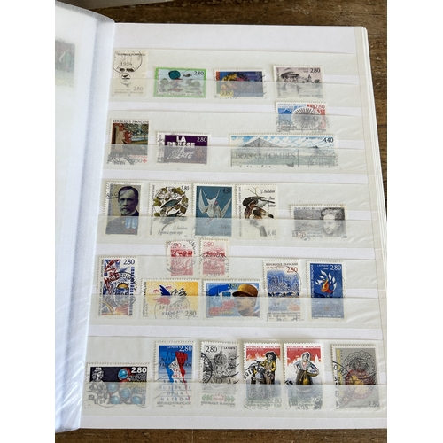 367 - Four stock books of stamps including mint stamps to include France, British Colony, Bermuda/Barbados... 