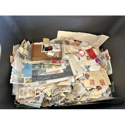375 - A large tub of loose stamps plus first day covers of mixed countries etc together with some informat... 