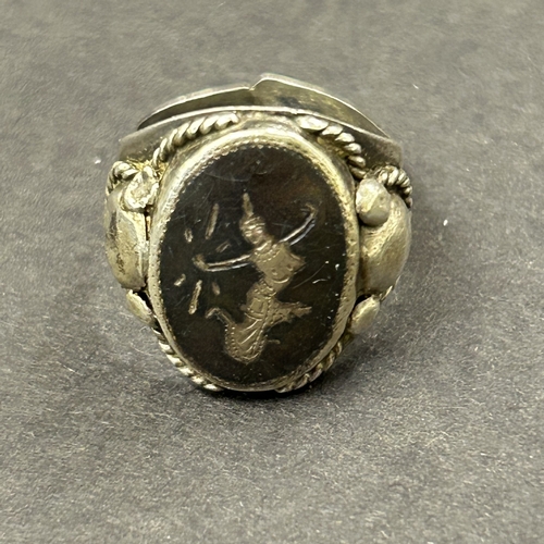 126 - Four sterling silver rings, weight approx. 21g (one ring as found) plus a titanium ring