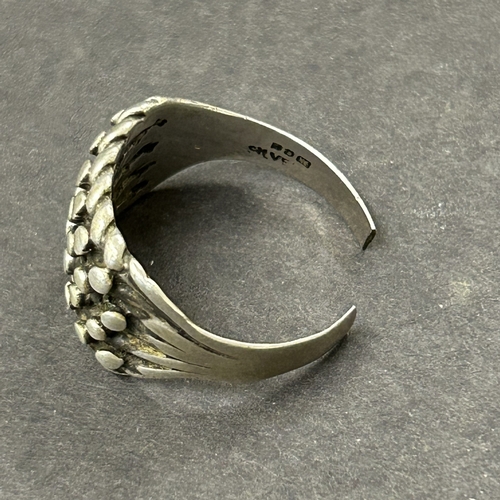 126 - Four sterling silver rings, weight approx. 21g (one ring as found) plus a titanium ring