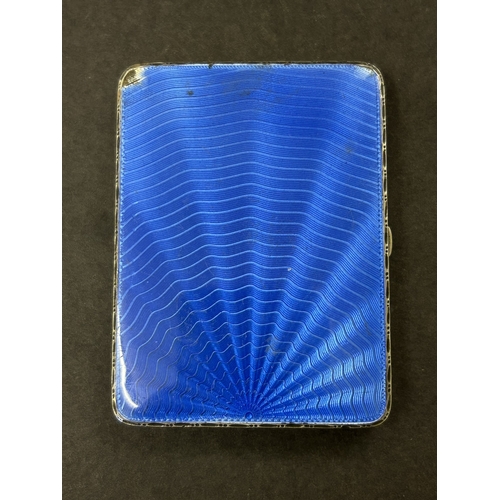 136 - A hallmarked silver and blue enamel cigarette case, just over 3