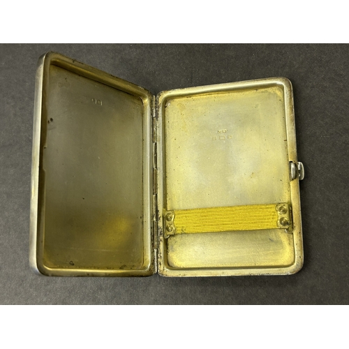 136 - A hallmarked silver and blue enamel cigarette case, just over 3