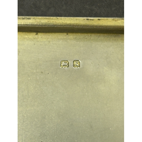 136 - A hallmarked silver and blue enamel cigarette case, just over 3