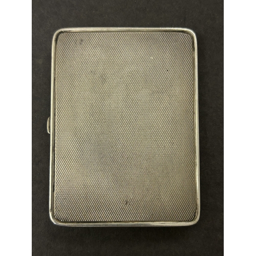 136 - A hallmarked silver and blue enamel cigarette case, just over 3