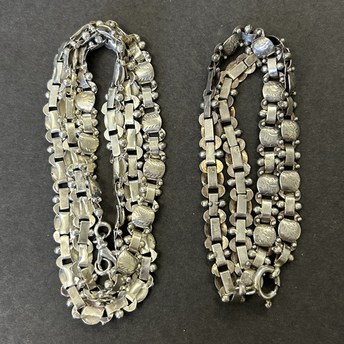 167 - Two similar styled chains, one marked for 925 sterling, the other with makers marks, combined weight... 