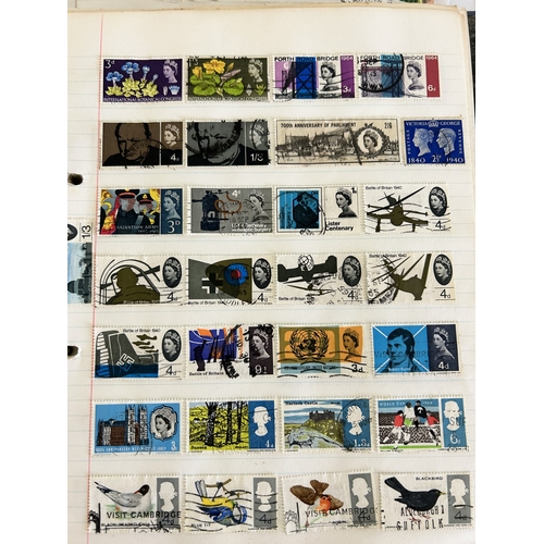 285 - A vintage stamp album with world contents together with two 1953 Coronations tins with stamps and a ... 