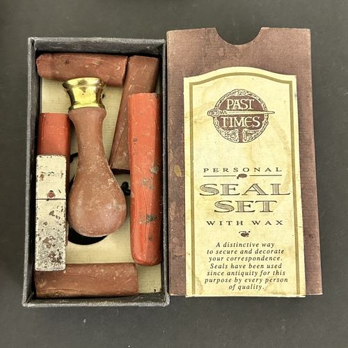 322 - A mixed lot of items to include a singing bowl, an aluminium boot jack, boxed dominos with crib boar... 