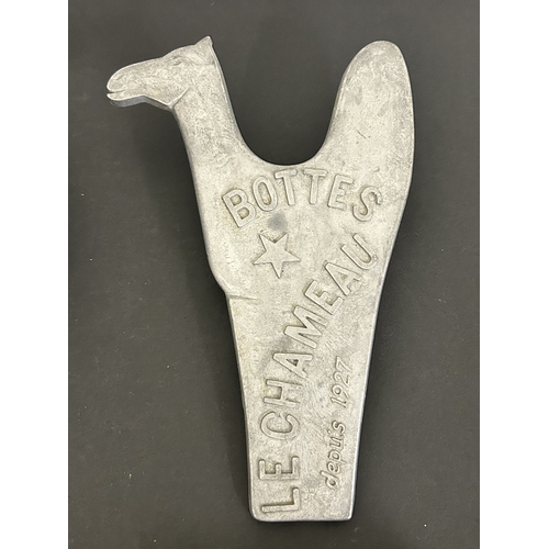 322 - A mixed lot of items to include a singing bowl, an aluminium boot jack, boxed dominos with crib boar... 