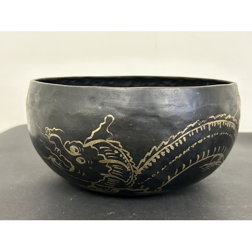 322 - A mixed lot of items to include a singing bowl, an aluminium boot jack, boxed dominos with crib boar... 