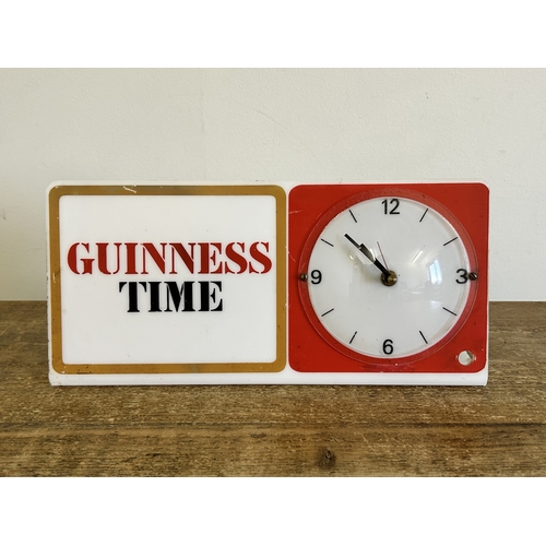 354 - A vintage formally electric 'Guinness Time' advertising clock, approx. 11 3/4