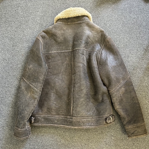 494 - A vintage 'Niche' fine leather and sheepskin style flying jacket, size 44 (age use)