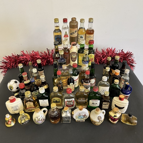 6 - A selection of mixed spirit miniatures including whiskies and liqueurs etc (three of the ceramic con... 