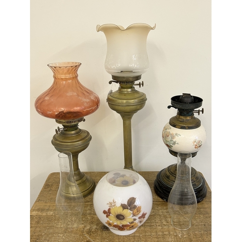 68 - Two brass oil lamps, the tallest approx. 18 1/2