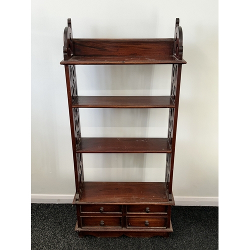 407 - A decorative mahogany shelf unit with four small drawers at the base, 44