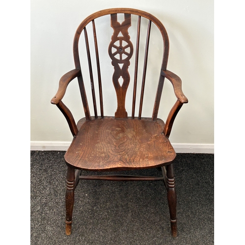 409 - An antique wheel back carver chair, back height 33 1/2