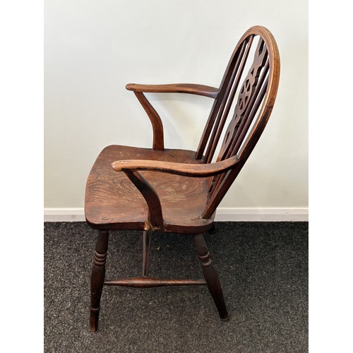 409 - An antique wheel back carver chair, back height 33 1/2