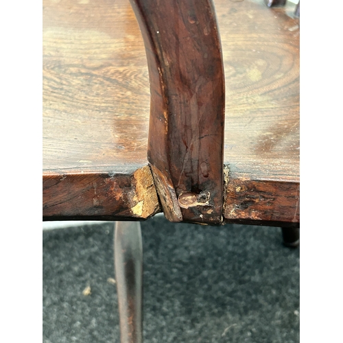 409 - An antique wheel back carver chair, back height 33 1/2