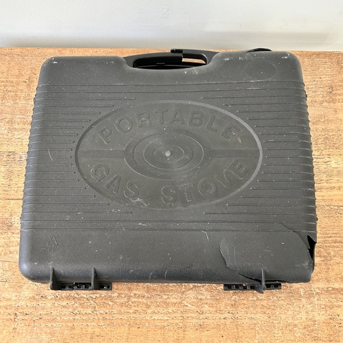 442 - A portable gas stove (appears unused, case as found)