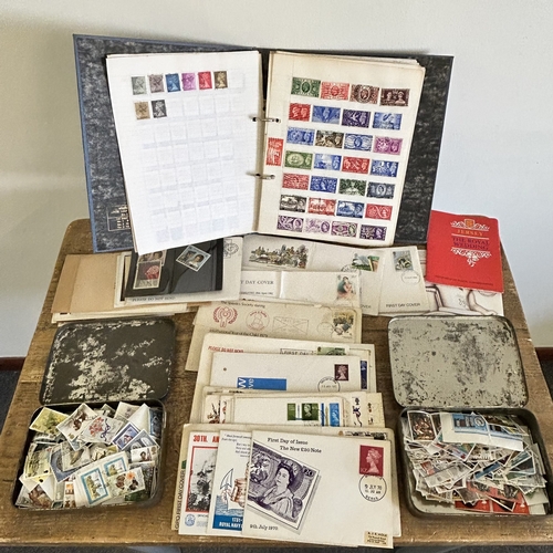426 - A vintage stamp album with world contents together with two 1953 Coronations tins with stamps and a ... 