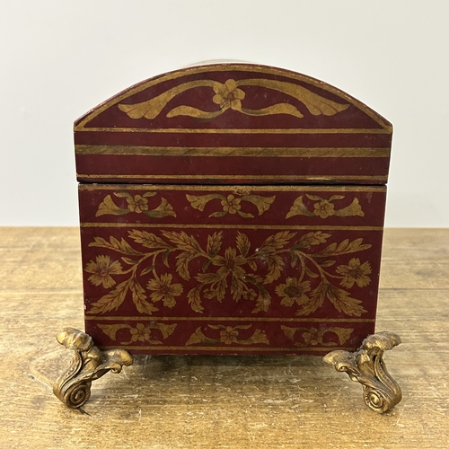 418 - A decorative 'Past Times' red and gold coloured dome top box on four gilded feet, approx. 15 1/2