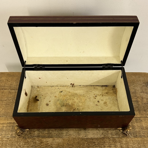 418 - A decorative 'Past Times' red and gold coloured dome top box on four gilded feet, approx. 15 1/2