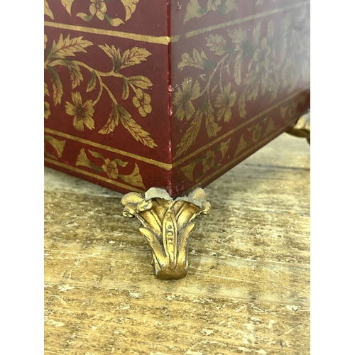 418 - A decorative 'Past Times' red and gold coloured dome top box on four gilded feet, approx. 15 1/2
