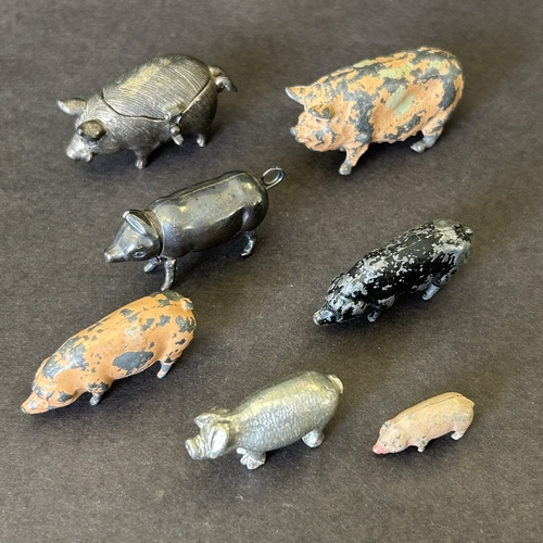 106 - Various vintage mini pig figures including a 925 sterling silver former vesta, white metal with lid,... 