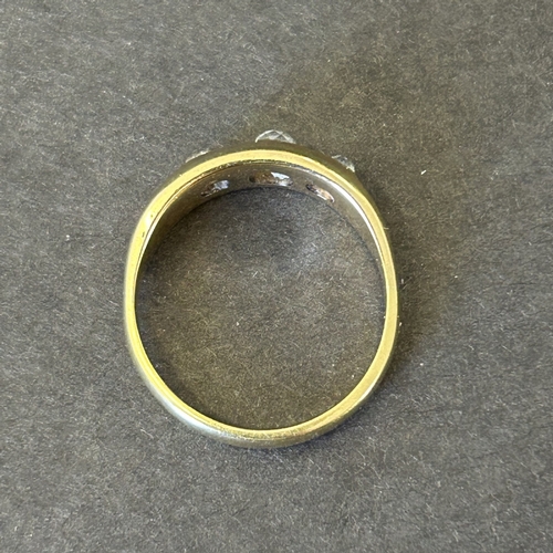 128 - A vintage yellow metal ring with three diamonds, approx. size N 1/2, weight approx. 5g
