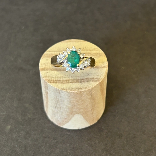 129 - An 18ct gold diamond and green stone ring, approx. size N, weight approx. 3.6g