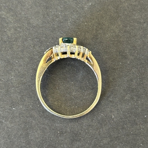 129 - An 18ct gold diamond and green stone ring, approx. size N, weight approx. 3.6g