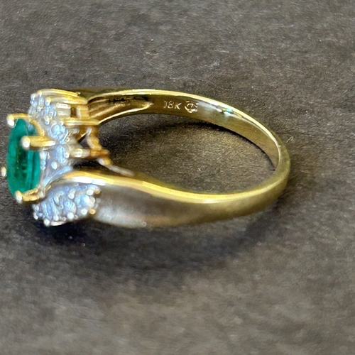 129 - An 18ct gold diamond and green stone ring, approx. size N, weight approx. 3.6g