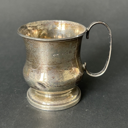 144 - A hallmarked silver small christening cup with loaded base, approx. 2 3/4