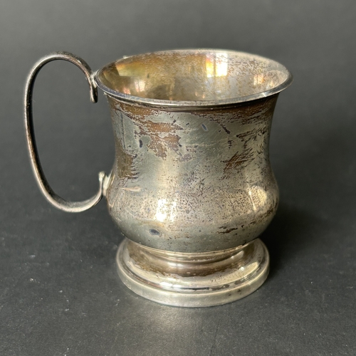 144 - A hallmarked silver small christening cup with loaded base, approx. 2 3/4