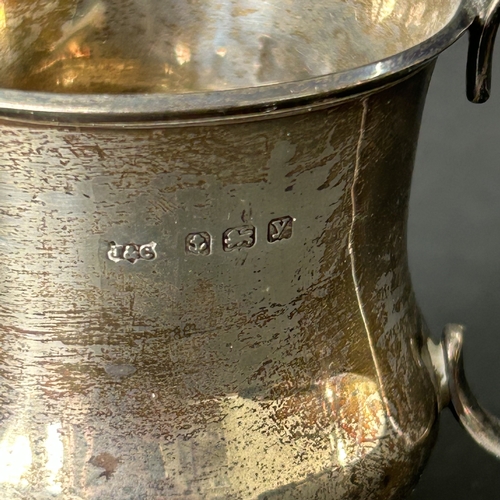 144 - A hallmarked silver small christening cup with loaded base, approx. 2 3/4