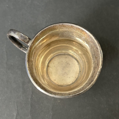 144 - A hallmarked silver small christening cup with loaded base, approx. 2 3/4