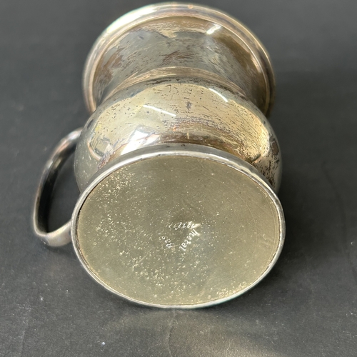 144 - A hallmarked silver small christening cup with loaded base, approx. 2 3/4