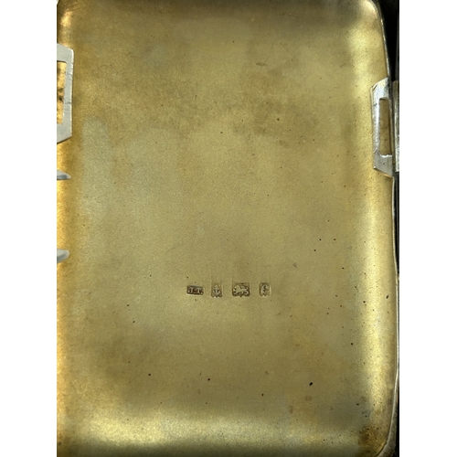 152 - A hallmarked silver small cigarette case with internal inscription for 1911, weight approx. 62g