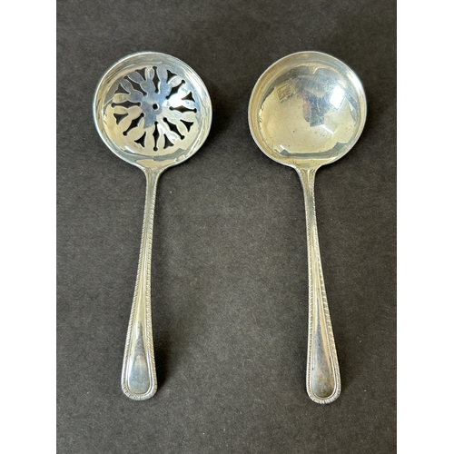 165 - A matching pair of hallmarked silver small ladle and sifting spoon, same maker, one marked for Birmi... 
