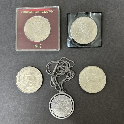 181 - A white metal coin in a white metal mount and chain plus a cased 1967 Gibraltar crown etc