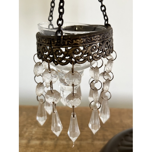 223 - A metal frame with three staggered height tealight holders, approx. 18 1/4